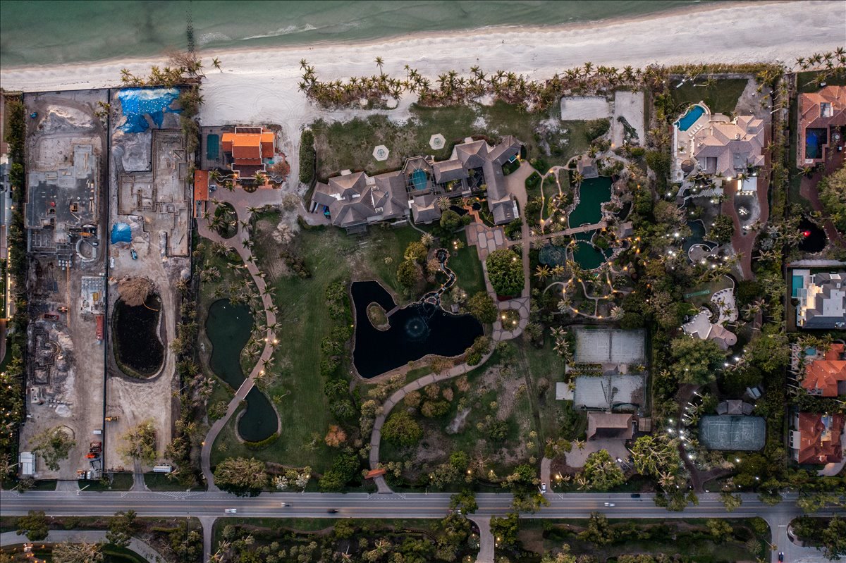 Top-down aerial of beachfront grounds and neighboring properties