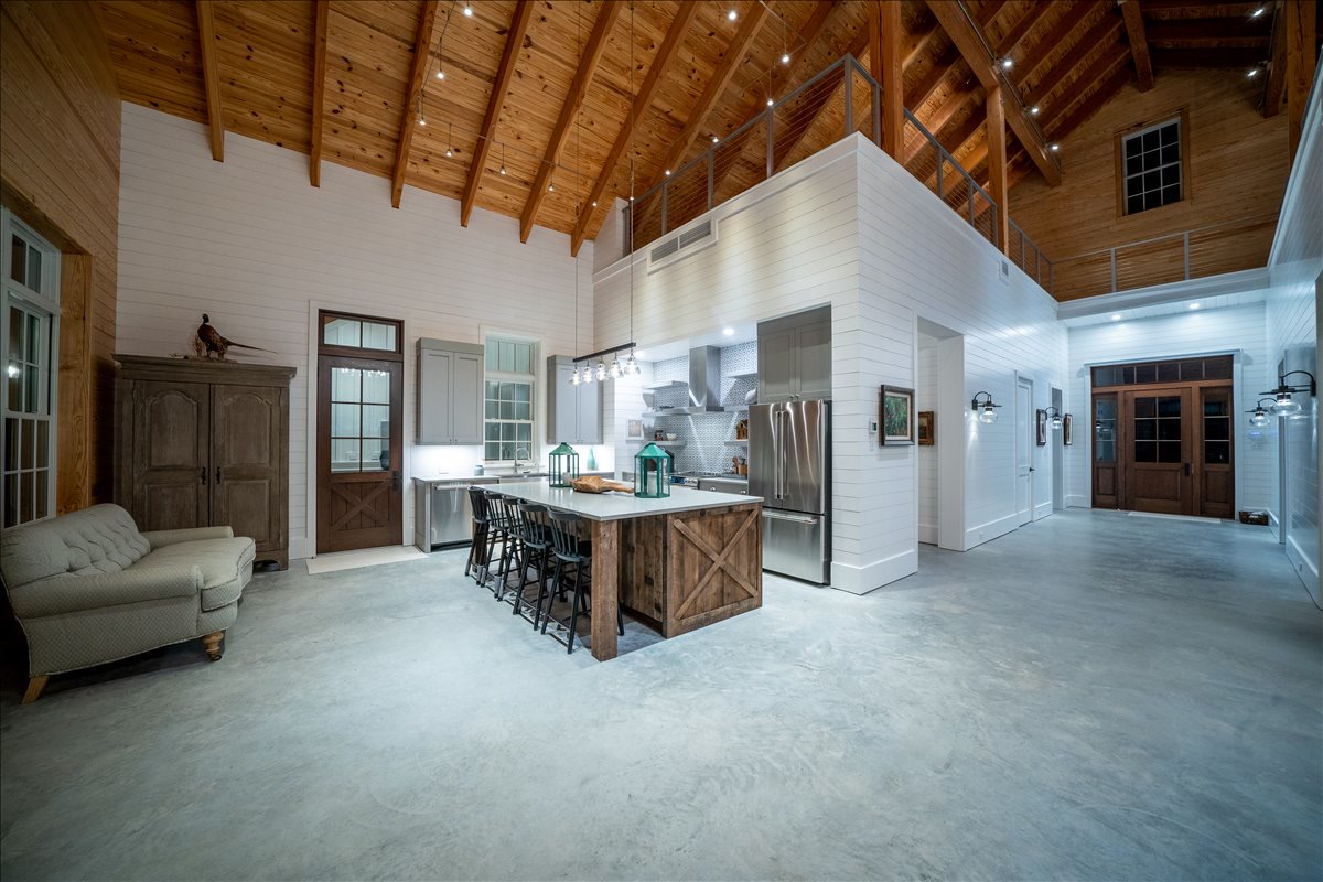 Timber-ceiling great room with an open central kitchen